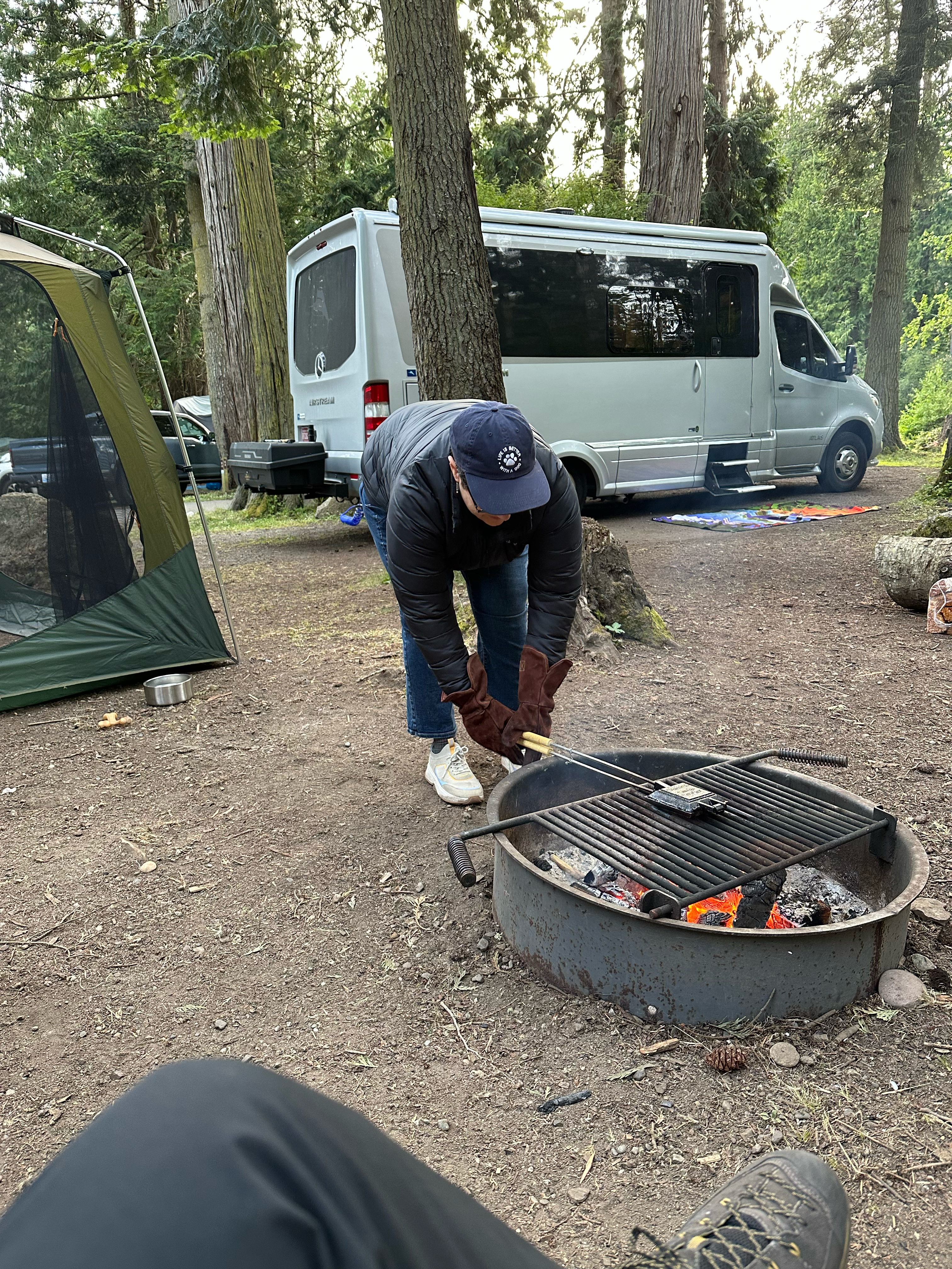 Noel cooking the pie over the fire 
