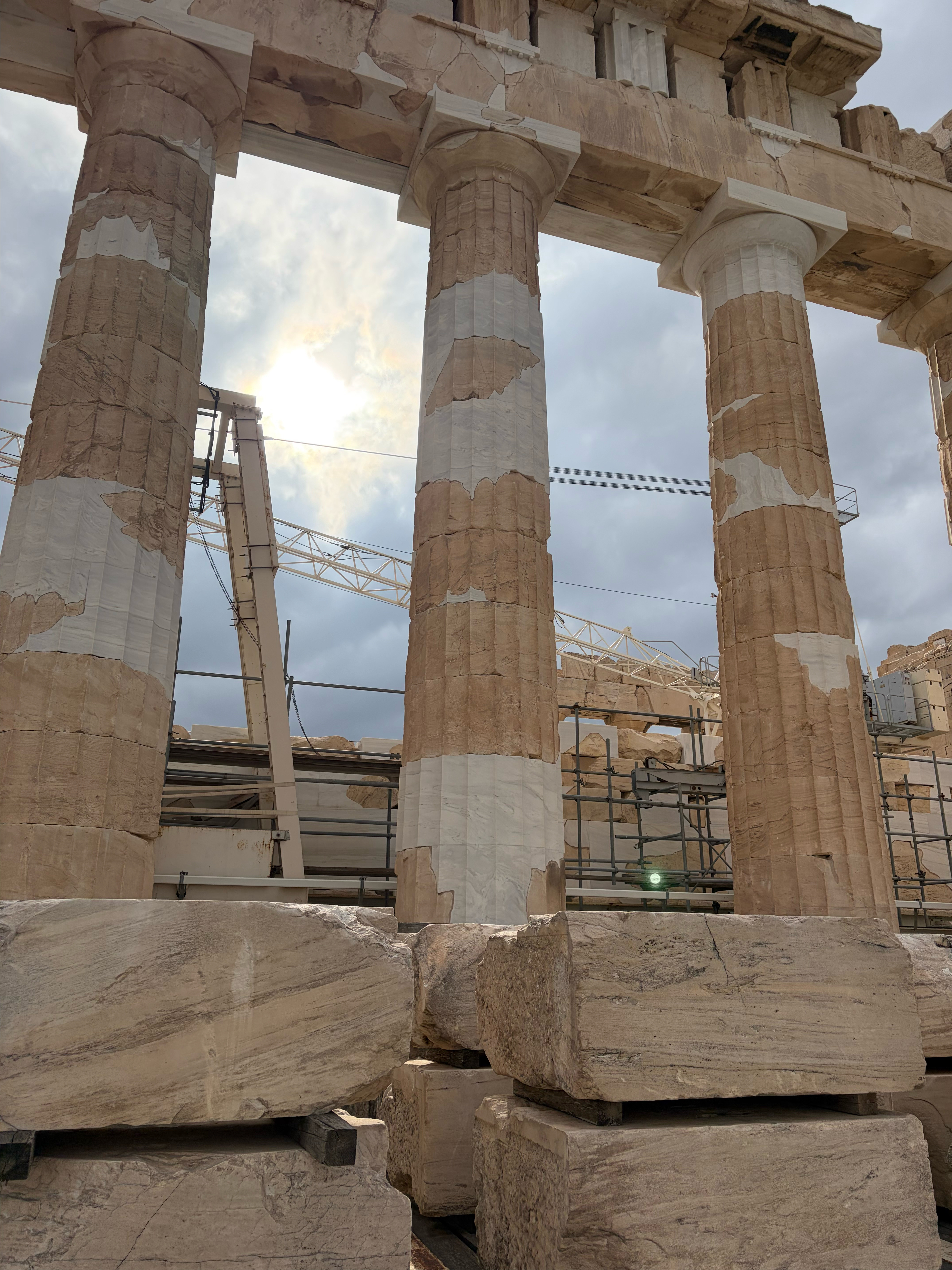 The “white” marble is part of the restoration being done - so you can easily distinguish between new marble and original marble