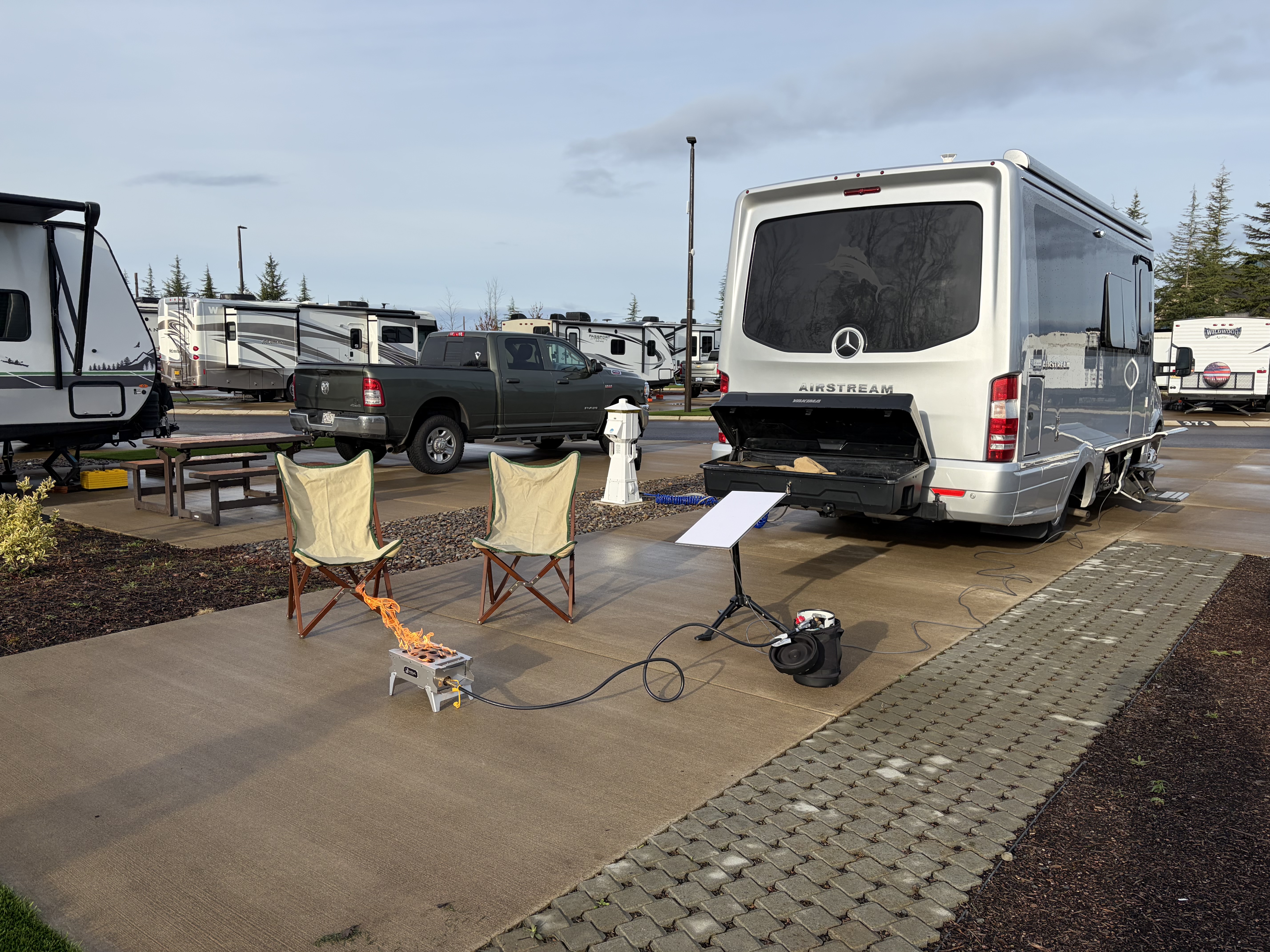 The chairs are set up and the new propane fire pit was lit this morning!  