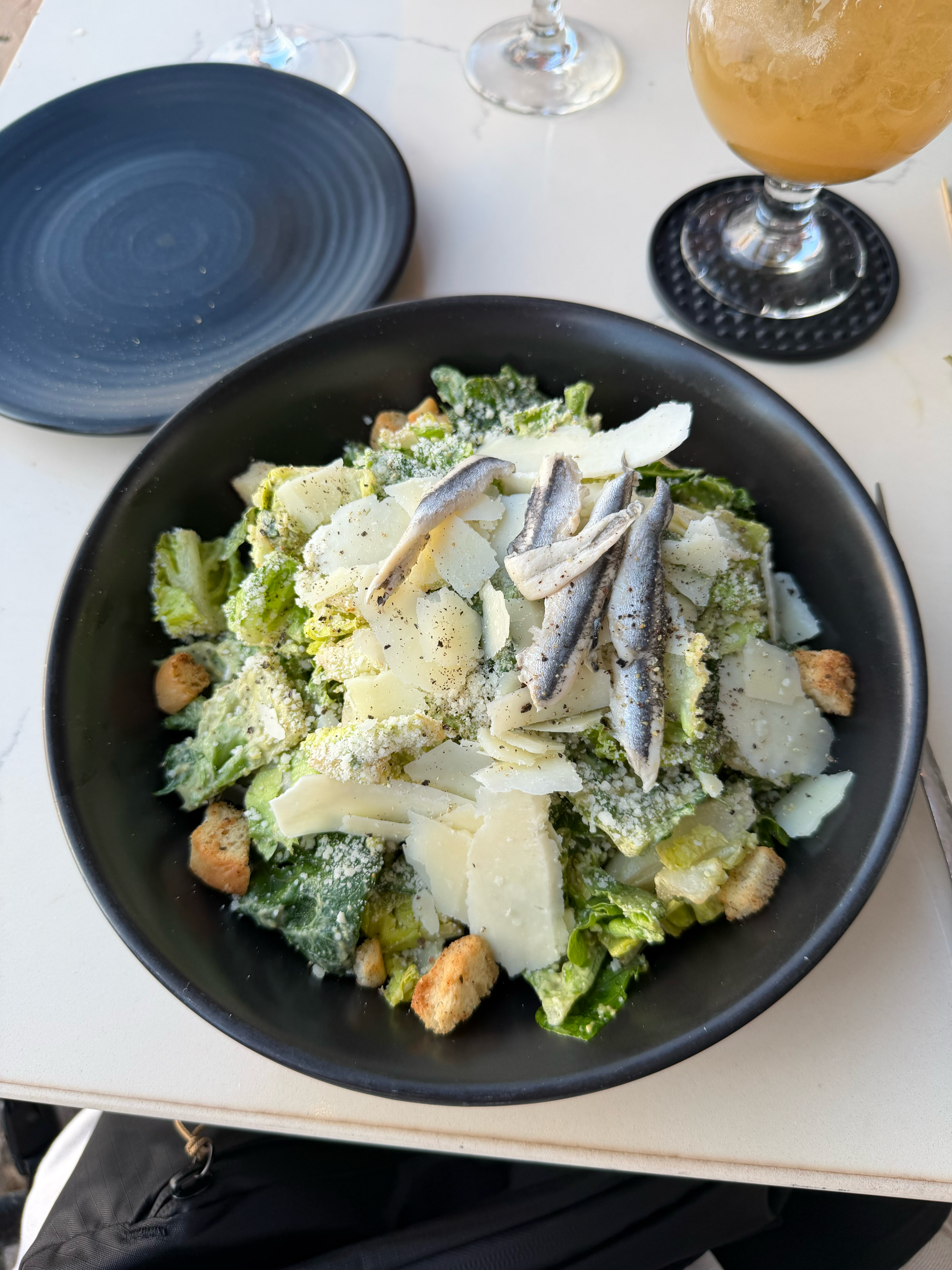 A chopped Caesar salad with white anchovies!