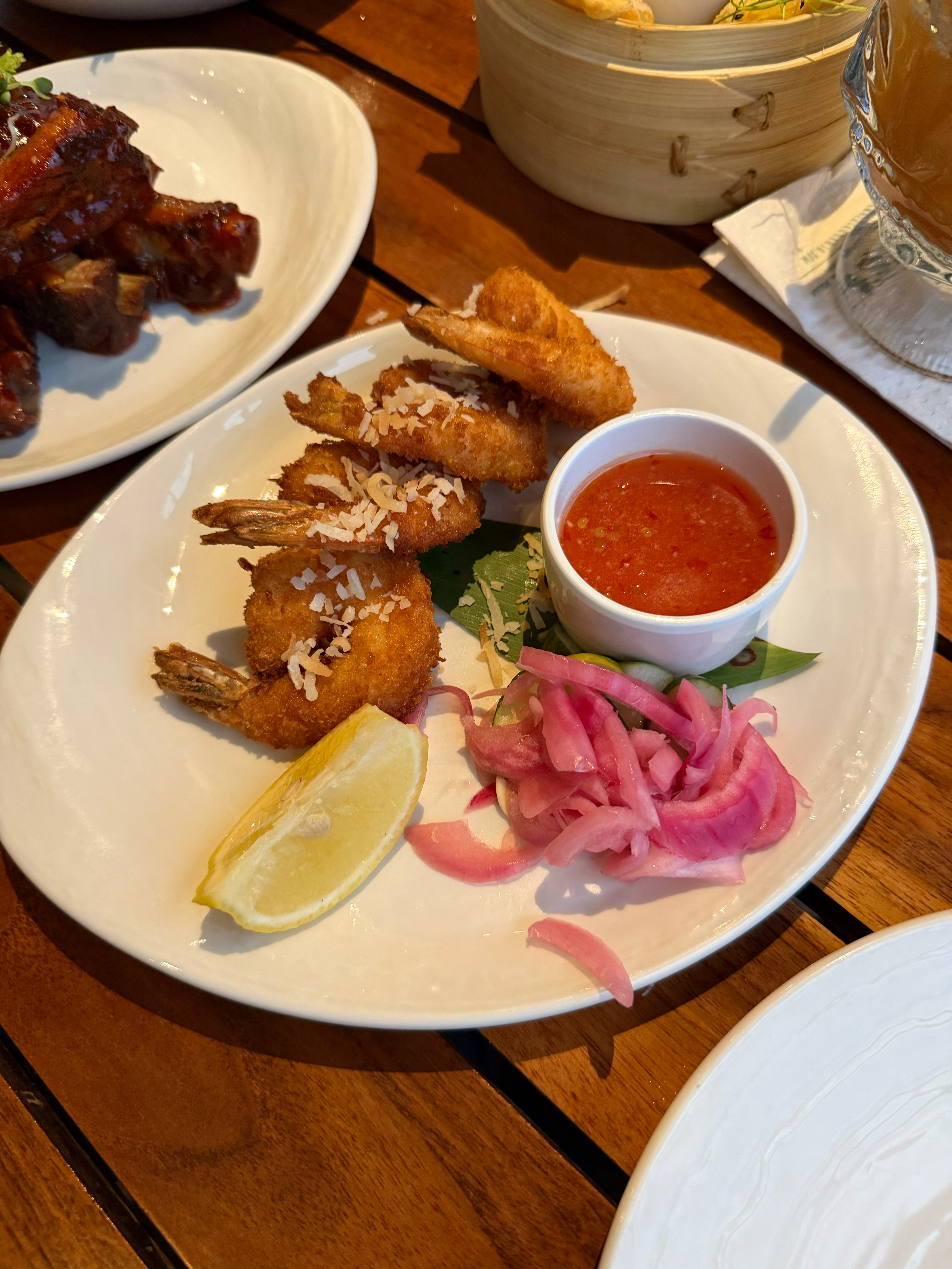 Crispy Coconut Shrimp with chili water and pickled cucumbers