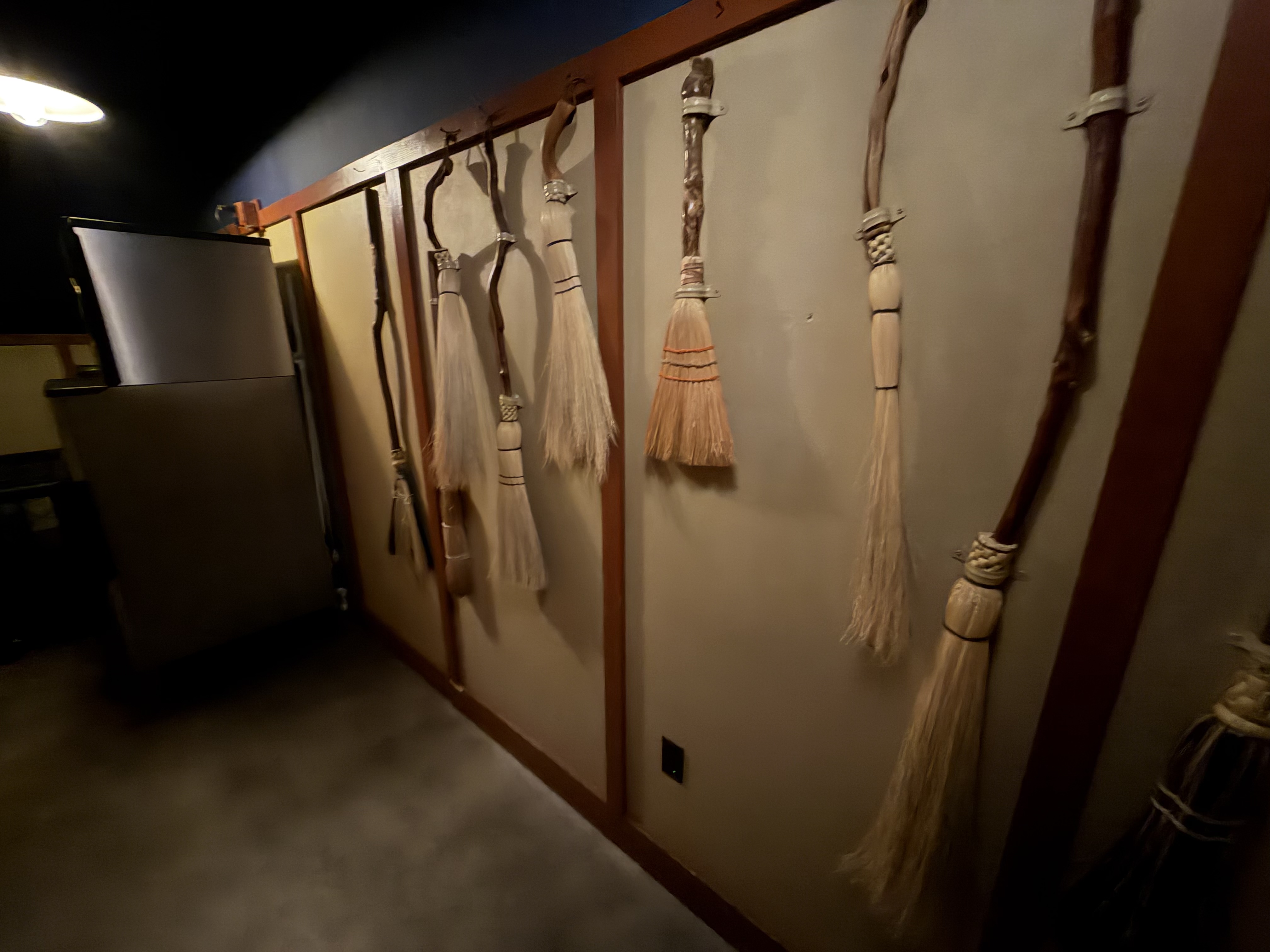 As expected - brooms in the broom closet! A cool door to the speakeasy.