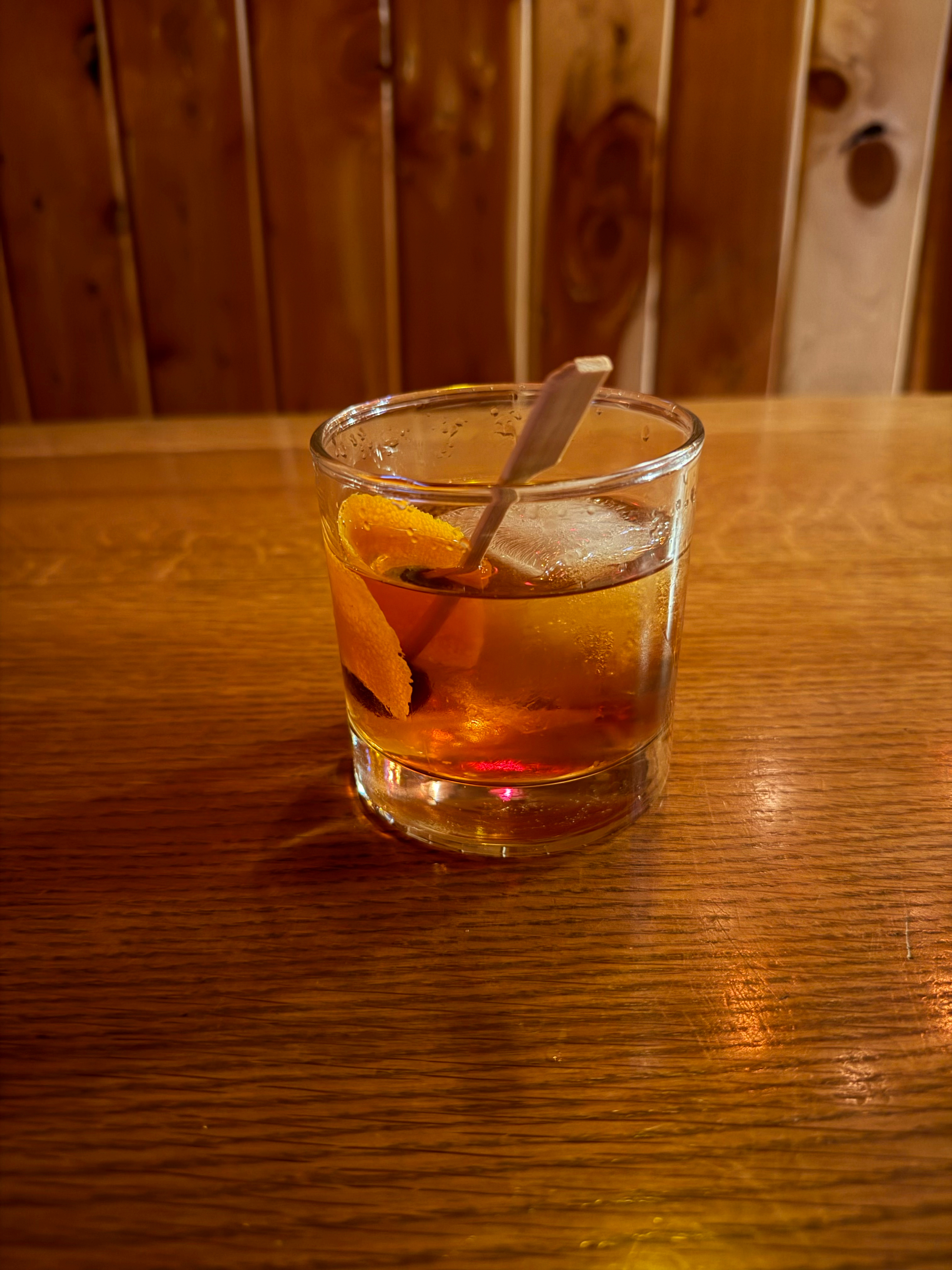 A delicious hand-crafted Gingerbread Old-Fashioned in the Broom Closet Bar