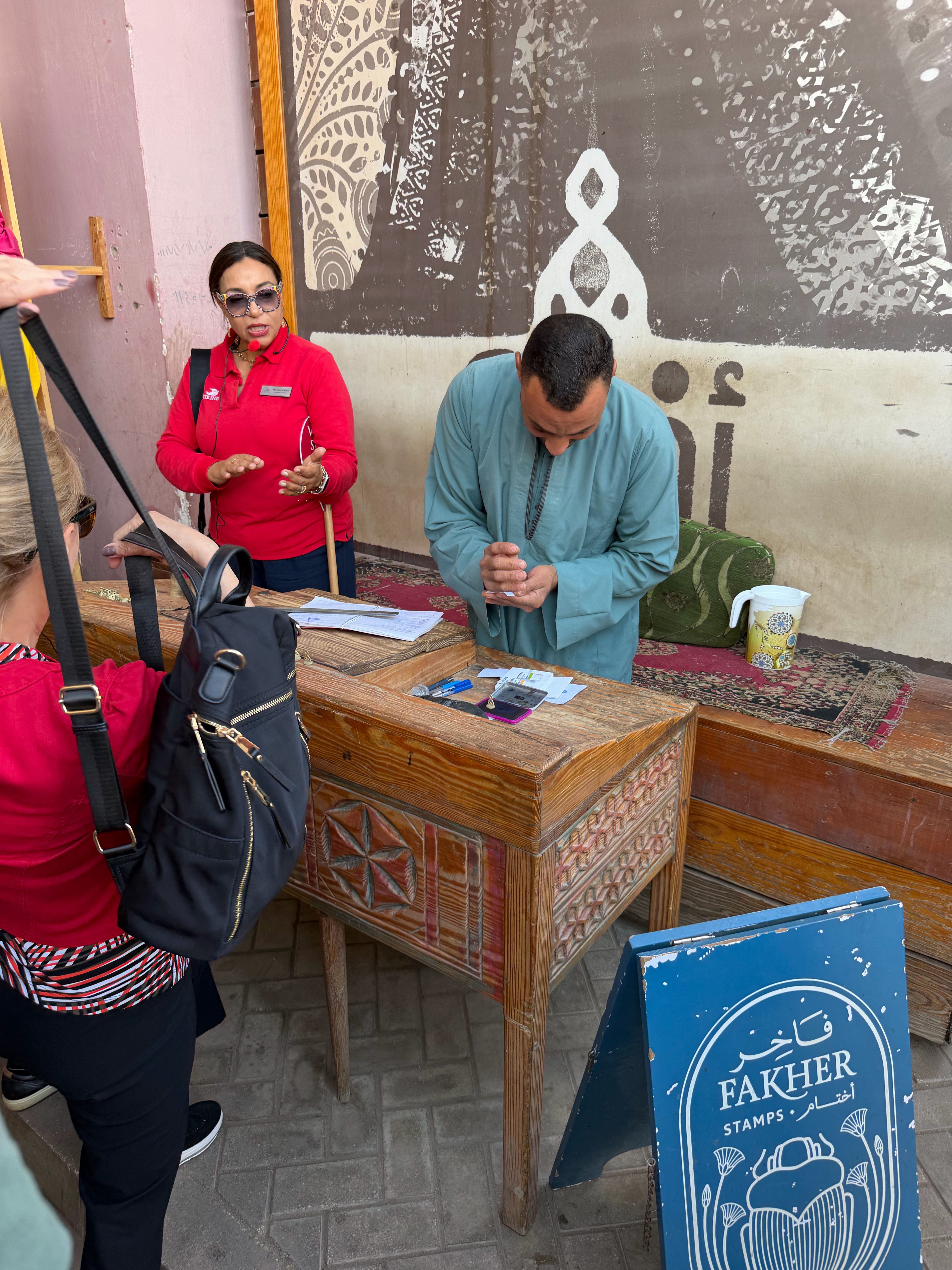 The stamp maker was hard at work making stamps by hand that could be used for a variety of business purposes by local citizens.
