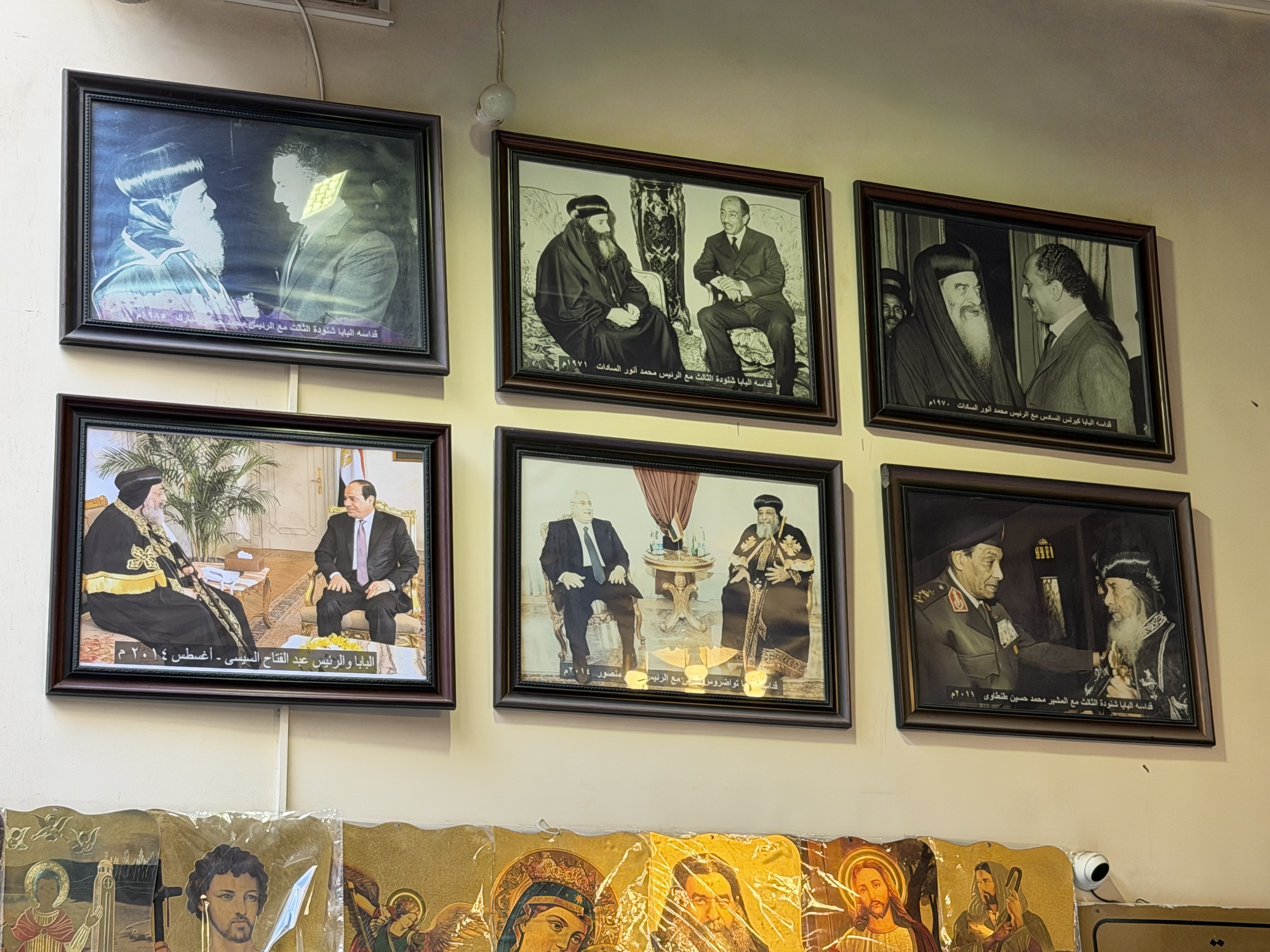 There were many pictures showing the leader of the Coptic Church meeting with Egyptian leaders over the past 100 years.