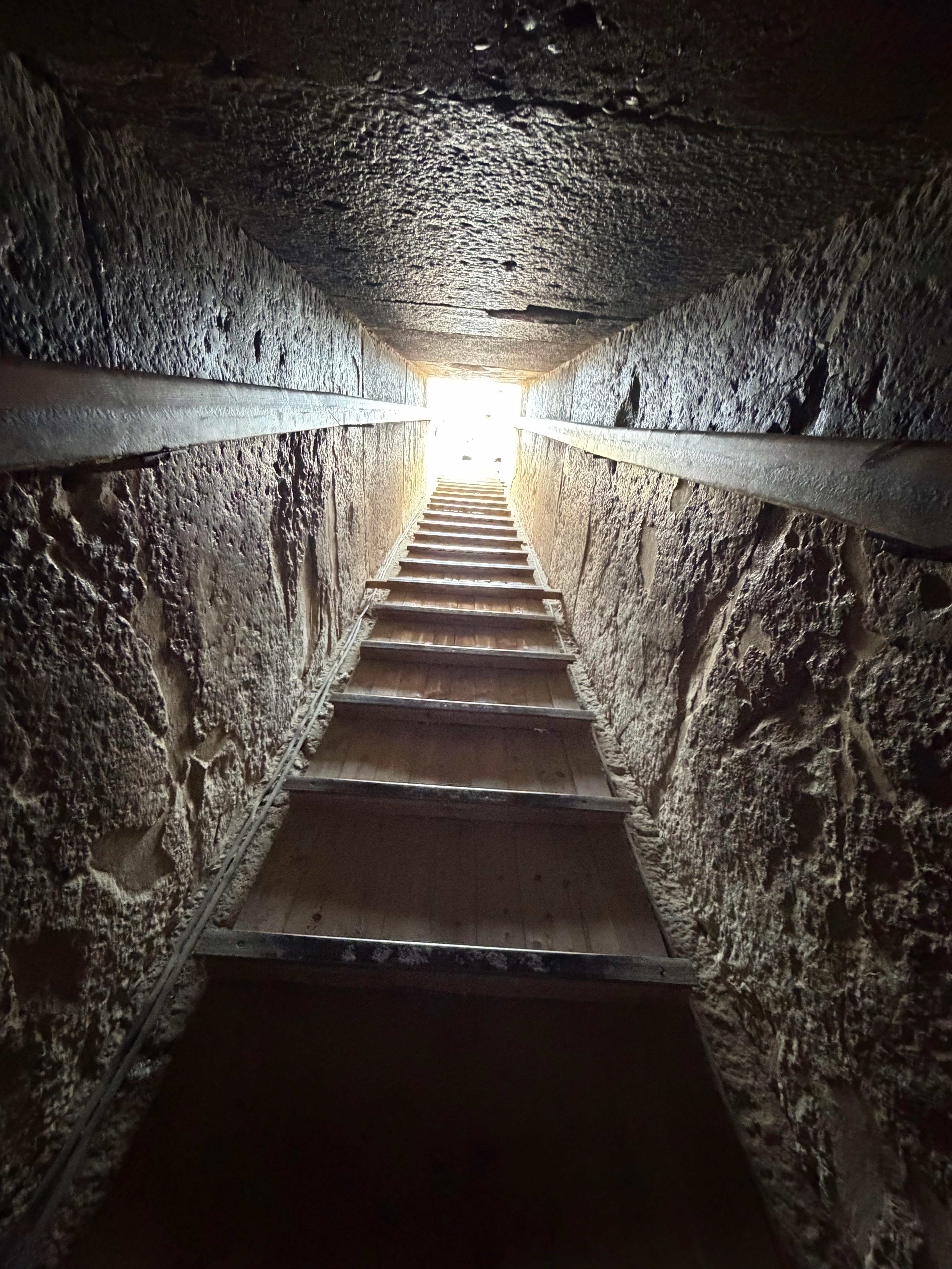 A view looking up at the small tunnel from the burial chamber to the surface.  